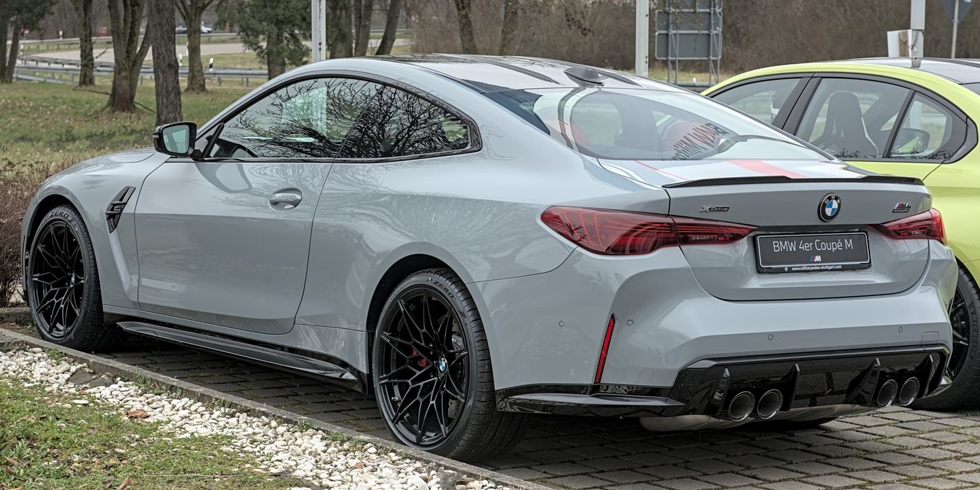 BMW M4 front brake caliper and rotor visible through wheel