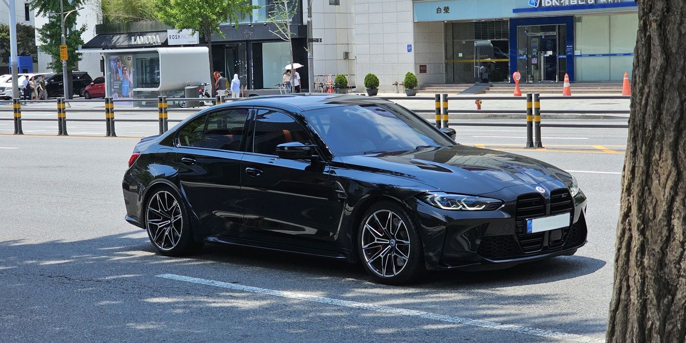 BMW M3 front brake caliper and rotor visible through wheel