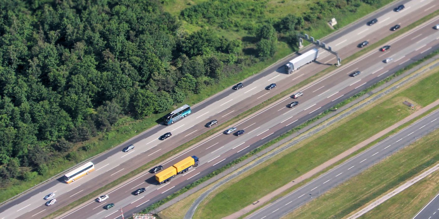 BMW driving on a German autobahn highway with open road ahead