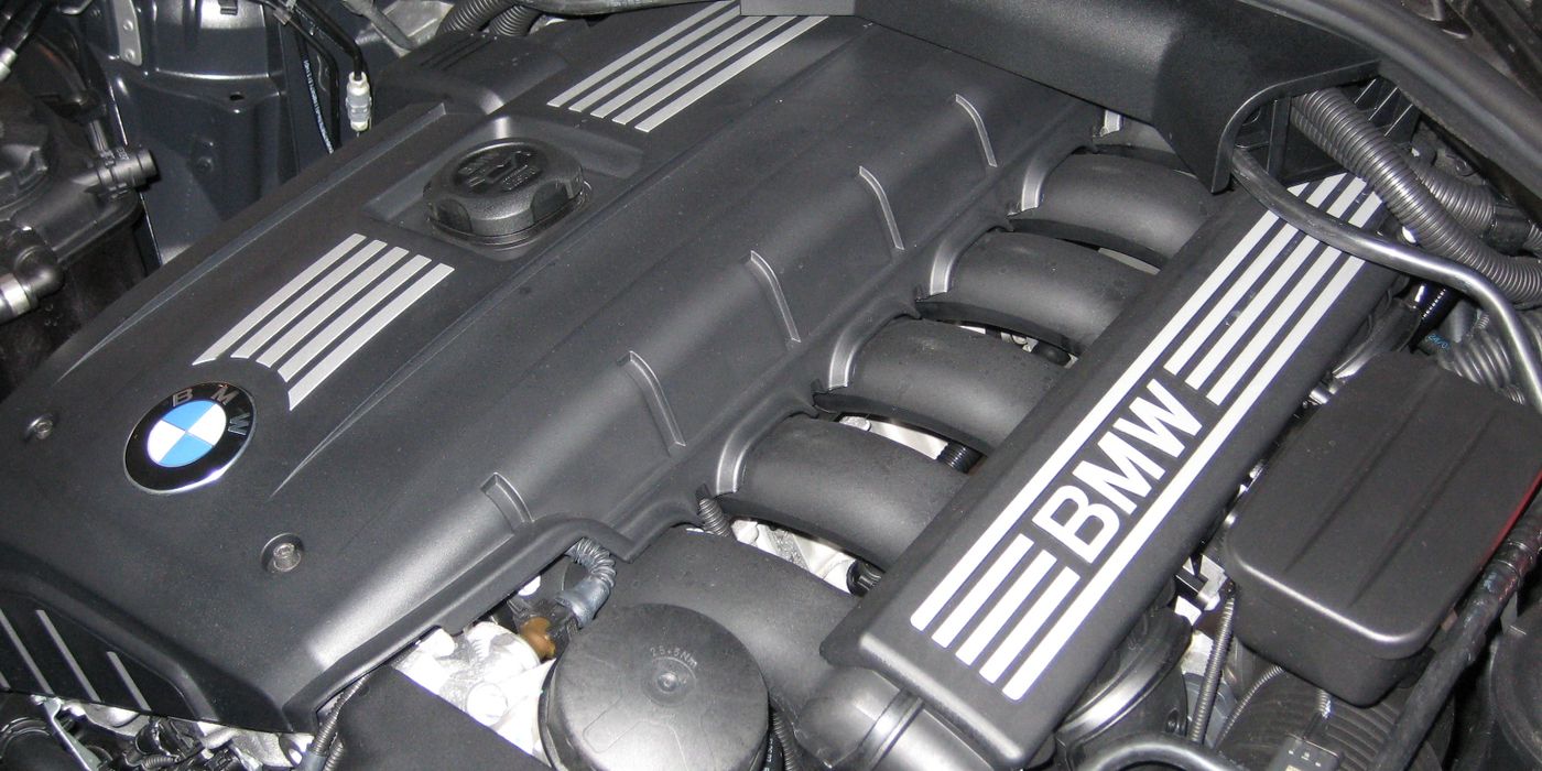 BMW N52 inline-six engine in the bay with valve cover, intake and ignition coil locations visible