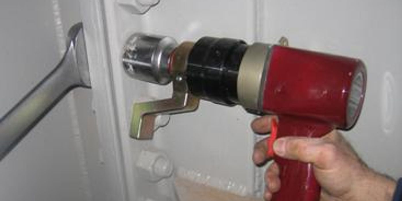 Torque wrench with socket attached, ready for spark plug installation