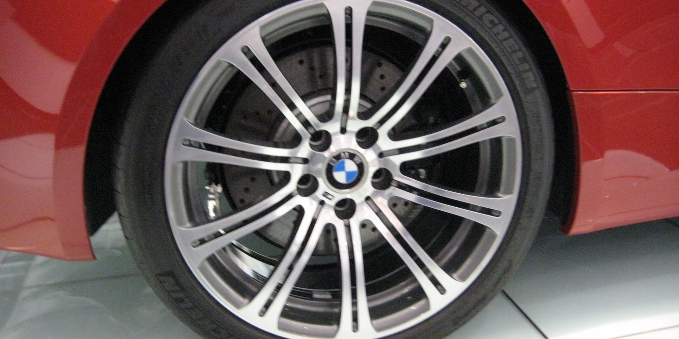 Close-up of a BMW E92 M3 front wheel filling the fender arch showing flush fitment