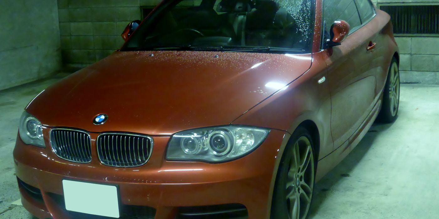 BMW 135i Coupe E82 front three-quarter view parked on pavement