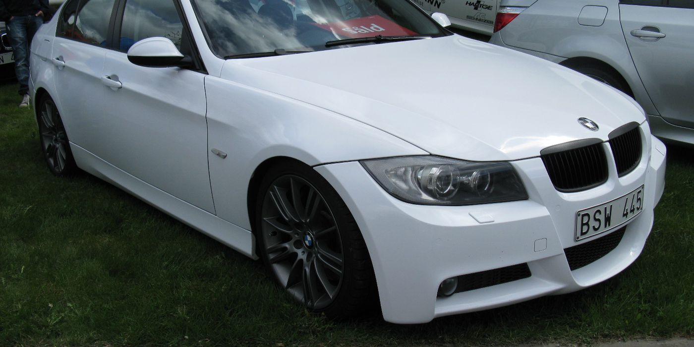 BMW E90 335i M Sport sedan front three-quarter view on the street