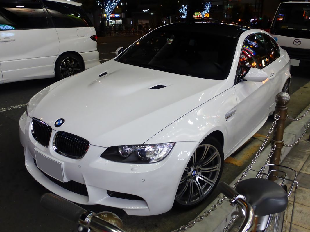 White BMW M3 E92 coupe front view at night, the 2008-2013 V8-powered M3 generation