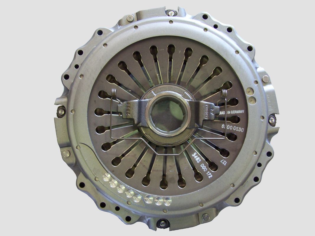 Automotive pull-type clutch assembly with friction disc visible and pressure plate fingers exposed