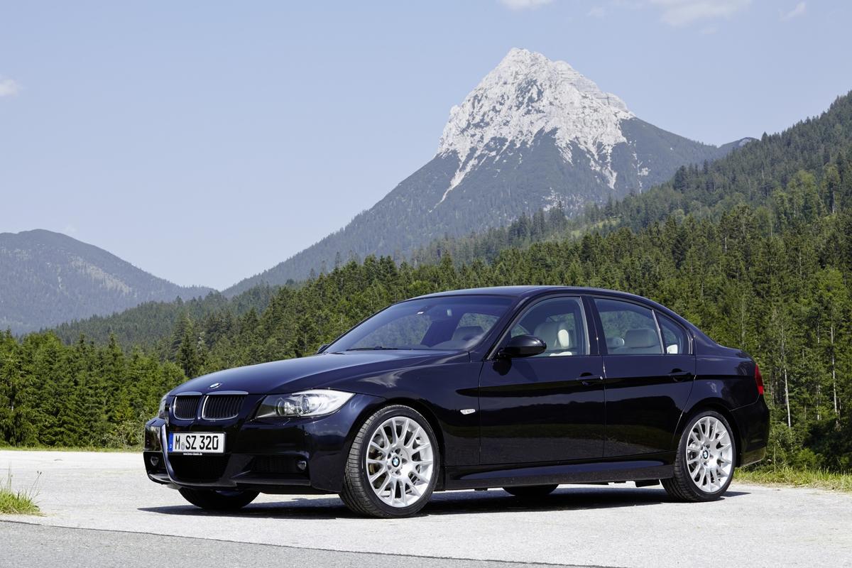 BMW E90 front brake caliper and rotor visible through wheel